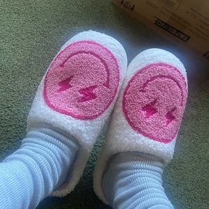 Pink smiley face lighting bolt slippers